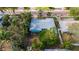 An aerial view of a teal home's backyard and surrounding neighborhood at 350 Gill St, Punta Gorda, FL 33950