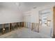 A gutted bedroom, showing exposed walls and flooring at 350 Gill St, Punta Gorda, FL 33950