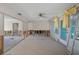 A living room in need of renovation, showing exposed framing at 350 Gill St, Punta Gorda, FL 33950