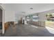 Open living area undergoing renovation, showing framing and flooring at 350 Gill St, Punta Gorda, FL 33950