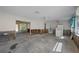 A gutted living room with exposed framing and flooring, ready for renovation at 350 Gill St, Punta Gorda, FL 33950