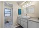 Bright bathroom with a single vanity and a view to the toilet and shower area at 3936 Crooked Island Dr, Punta Gorda, FL 33950