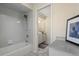 Bathroom featuring a tub/shower combo with dual sinks and a connecting door to the vanity at 3936 Crooked Island Dr, Punta Gorda, FL 33950