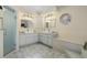 Modern bathroom with a walk-in shower, dual sinks, and a unique octagon window at 3936 Crooked Island Dr, Punta Gorda, FL 33950
