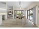 Bright dining area with sliding glass doors to the lanai, and a view of the kitchen at 3936 Crooked Island Dr, Punta Gorda, FL 33950