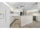 Spacious white kitchen features stainless steel appliances, ample cabinet space, and a center island at 3936 Crooked Island Dr, Punta Gorda, FL 33950