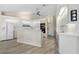 Well-lit kitchen with white cabinets, stainless steel appliances, and an eat-in kitchen at 3936 Crooked Island Dr, Punta Gorda, FL 33950
