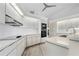 Bright kitchen with modern appliances, white cabinetry, and sleek countertops at 3936 Crooked Island Dr, Punta Gorda, FL 33950