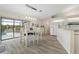 Bright kitchen with stainless appliances and a dining area with access to the lanai at 3936 Crooked Island Dr, Punta Gorda, FL 33950
