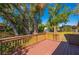 Backyard with wooden deck and mature trees at 1327 Abscott St, Port Charlotte, FL 33952