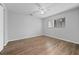 Bright bedroom with wood-look floors and ceiling fan at 1327 Abscott St, Port Charlotte, FL 33952