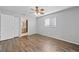 Bright bedroom with laminate wood flooring and access to bathroom at 1327 Abscott St, Port Charlotte, FL 33952