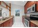 Bright kitchen with granite countertops and wood cabinets at 1327 Abscott St, Port Charlotte, FL 33952