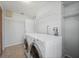 Laundry room with washer, dryer, and ample storage at 1327 Abscott St, Port Charlotte, FL 33952