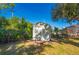White storage shed in the backyard at 1327 Abscott St, Port Charlotte, FL 33952