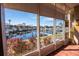 Bright sunroom with water views and tile floors at 143 Tropicana Dr # 1012, Punta Gorda, FL 33950