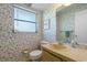 Bathroom featuring floral wallpaper, a mirrored vanity, and a small frosted window at 2501 Rio Largo Ct, Punta Gorda, FL 33950