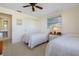 Bright bedroom with two twin beds, a closet, and an open en-suite bathroom at 2501 Rio Largo Ct, Punta Gorda, FL 33950