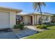 Charming exterior featuring a well-maintained lawn, mature landscaping, and a clean, inviting facade at 2501 Rio Largo Ct, Punta Gorda, FL 33950