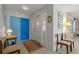 Bright foyer with terrazzo floors, stained glass window features, and vibrant blue closet doors at 2501 Rio Largo Ct, Punta Gorda, FL 33950