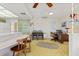 View of an open living room with a breakfast bar, vintage yellow floor, and built-in green storage at 2501 Rio Largo Ct, Punta Gorda, FL 33950
