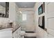 Modern bathroom with a large walk-in shower and dark vanity at 5117 Collingswood Blvd, Port Charlotte, FL 33948