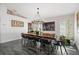 Bright dining room features a unique wood table and chandelier at 5117 Collingswood Blvd, Port Charlotte, FL 33948