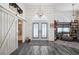 Elegant entryway with double doors, barn door, and tile flooring at 5117 Collingswood Blvd, Port Charlotte, FL 33948