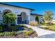 Landscaped walkway leading to the front entrance of the home at 5117 Collingswood Blvd, Port Charlotte, FL 33948