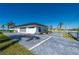 Spacious garage with a large door and plenty of parking space at 5117 Collingswood Blvd, Port Charlotte, FL 33948