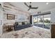 Gathering room with wood-paneled accent wall and access to the pool at 5117 Collingswood Blvd, Port Charlotte, FL 33948