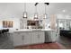 Spacious kitchen with island, stainless steel appliances, and white cabinetry at 5117 Collingswood Blvd, Port Charlotte, FL 33948