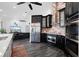 Modern kitchen with stainless steel appliances and a large island at 5117 Collingswood Blvd, Port Charlotte, FL 33948
