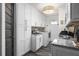 Bright laundry room with ample cabinetry and workspace at 5117 Collingswood Blvd, Port Charlotte, FL 33948