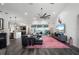Spacious living room with sectional sofa, large TV, and water view at 5117 Collingswood Blvd, Port Charlotte, FL 33948