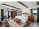 Large main bedroom with water views, wood beams, and cozy sitting area at 5117 Collingswood Blvd, Port Charlotte, FL 33948