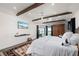 Spacious main bedroom with water views and wood beam ceiling at 5117 Collingswood Blvd, Port Charlotte, FL 33948