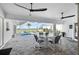 Spacious patio area with pool, seating and water view at 5117 Collingswood Blvd, Port Charlotte, FL 33948