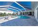 Inviting pool and spa with covered patio and water views at 5117 Collingswood Blvd, Port Charlotte, FL 33948