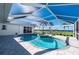Relaxing pool and spa with a covered patio overlooking the water at 5117 Collingswood Blvd, Port Charlotte, FL 33948