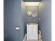 Small powder room with granite vanity and decorative mirrors at 5117 Collingswood Blvd, Port Charlotte, FL 33948