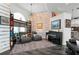 Cozy sitting area with fireplace, brick wall, and built-in shelving at 5117 Collingswood Blvd, Port Charlotte, FL 33948