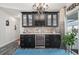 Stylish wet bar with wine storage and dark cabinetry at 5117 Collingswood Blvd, Port Charlotte, FL 33948