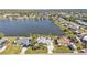 Bird's-eye view of a waterfront property with pool and tropical landscaping at 5200 Chaves Cir, Port Charlotte, FL 33948