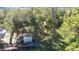 Overhead view of property with shed, trees and a truck at 14454 Nw Chamberlain Blvd, Port Charlotte, FL 33953