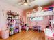 bedroom with a loft bed, desk, and lots of toys at 14454 Nw Chamberlain Blvd, Port Charlotte, FL 33953