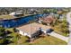 Aerial view showing single-story home, canal views, and neighborhood context at 831 Via Tunis, Punta Gorda, FL 33950