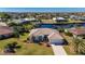 Aerial view of a canal-front home with a pool and private dock at 831 Via Tunis, Punta Gorda, FL 33950