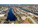 Aerial view of a canal-front house with a private pool and dock at 831 Via Tunis, Punta Gorda, FL 33950