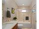 Updated bathroom with a tub, shower, and modern vanity at 831 Via Tunis, Punta Gorda, FL 33950